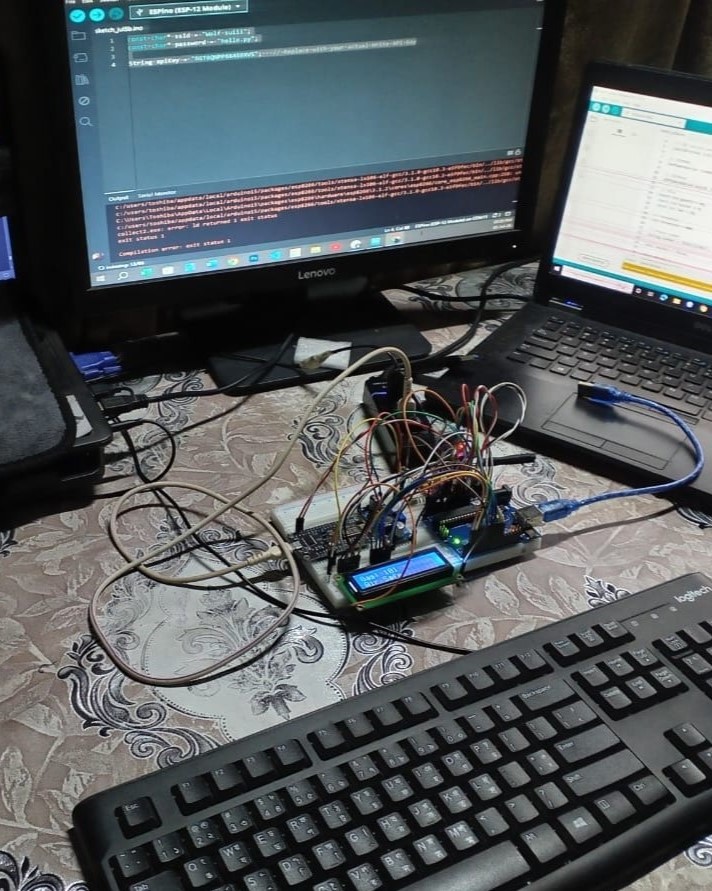 IoT project setup with computer and electronics